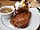 Grilled steak with baked potato and gravy.jpg