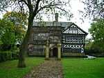 Hall i th Kayu manor rumah depan view.jpg