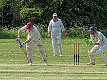 A batsman wearing batting gloves and a wicket-keeper wearing wicket-keeping gloves. Harlow Town CC v Old Victorians CC at Harlow, Essex, England 033.jpg