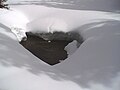 A hole in snow, shaped as a heart, in the Oregon Cascades near Willamette Pass