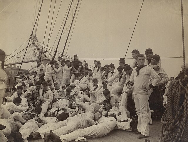 U.S. Naval Academy midshipmen skylarking aboard USS Essex, 1893. Midshipman Henry Mustin is in the foreground on the left.