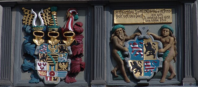 At the City Hall of Hildburghausen, two coats of arms are presented – for the Duchy of Saxe-Hilburghausen on the left and the City of Hildburghausen o