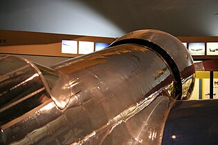 The radial engine nacelle is oversized to allow exhaust to escape