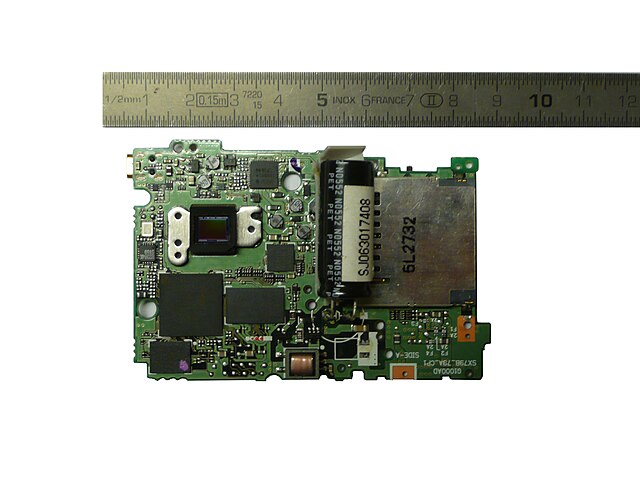Image sensor (upper left) on the motherboard of a Nikon Coolpix L2 6 MP