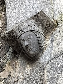 Effigy of a King in Ennis Friary. It sits under an arch opposite an effigy of a bishop on the other side of the arch. c. 1450-1470 King Effigy Ennis Friary.jpg