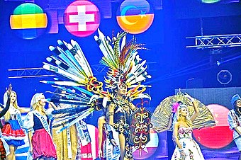 Lily (center) during the Miss Supranational 2014 Finale National Costume Competition, where she ended up won "Best National Costume" award on 5 December 2014. Lily Estelita Liana During Miss Supranational 2014.jpg