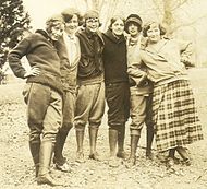 Teenage girls in Minnesota wearing breeches and riding boots with men's neckties, 1924.