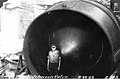Man standing inside Larner-Johnson flow control valve during installation at Gorge Dam Powerhouse, August 22, 1923 (SPWS 226).jpg