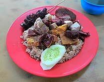 Indonesian Chinese nasi campur with pork satay