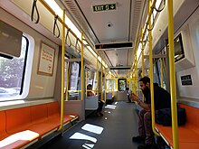 Interior of a new #14 CRRC car New Orange Line Train Interior 04.jpg