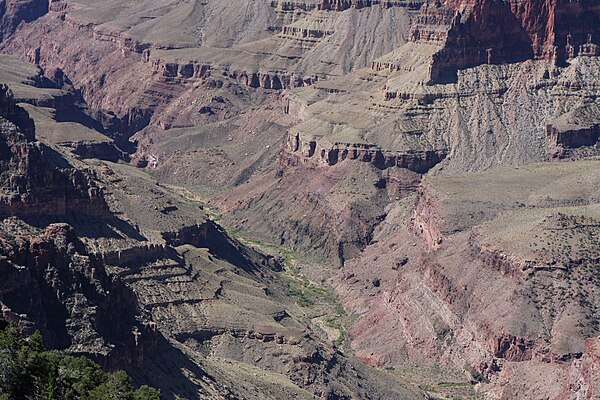 From Komo Point / Komo Point Trail, a few sections near Granite Gorge of black Vishnu Basement Rocks and a section of the layered Bass Limestone (note