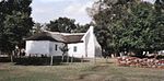 This simple, picturesque, mud-walled, thatched cottage dates from the mid-nineteenth century and was built by the Transvaal pioneer David Botha. Type of site: House RSA - Pinoneer Museum.JPG