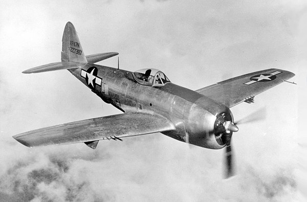 The Republic P-47D was armed with eight .50-caliber (12.7 mm) machine guns, and could carry a bomb load of 2,500 lb (1,100 kg).