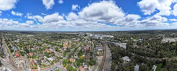 Ringwood Aerial Panorama of its Train Station and the Melbourne skyline on the horizon. January 2024.