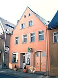 Residential building with shop in closed development