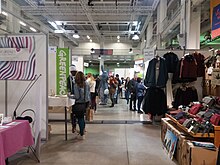 Main alley at VeggieWorld Lyon 2019 with various stands Salon VeggieWorld Lyon 2019 - La Sucriere - Allee principale avec un lapin.jpg