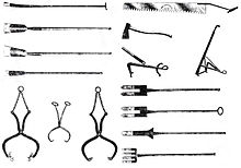 Selection of late 19th century specialist ice tools; clockwise from top left, chisels; ice saw, ice adze, grapples; bars; tongs Selection of ice tools.jpg