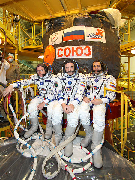 File:Soyuz TMA-01M Crew in front of the capsule.jpg
