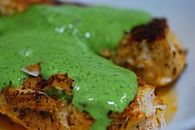 Close-up of parsley mint sauce on Spanish spice rubbed chicken Spanish spice rubbed chicken with parsley mint sauce.jpg