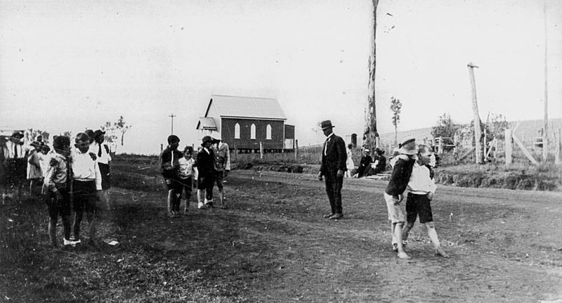 File:StateLibQld 2 178415 Boys taking part in a three-legged race near St. David's Church, Boonara, 1920s.jpg