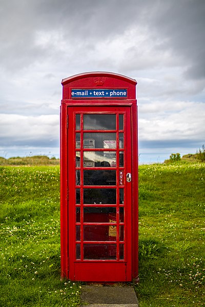 File:Telephone booth in the land.jpg