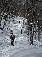 Snowboarders ascending near the Needles Eye on the Thunderbolt, January 2015 Thunderbolt Skiers.jpg