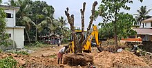 Pongamia pinnata Tree transplantation in Feliz Homes Kottakkal Malappuram dt Kerala India. Transplanting 100z.jpg