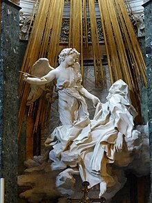 Ecstasy of Saint Teresa (1675), by Gian Lorenzo Bernini. The transverberation of Teresa of Avila is one of the most iconic mystical experiences in Roman Catholicism. Extasis de Santa Teresa, Gian Lorenzo Bernini, Roma, Italia, 2019 05.jpg