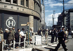 1945 Image of Hattori Tokei-ten building used by GHQ at Ginza 4-chome intersection.jpg