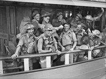 Members of the 22nd Brigade on board a ferry at Sydney, New South Wales, bound for the ship assigned to transport them to Malaya 2-18th on Ferry.jpg