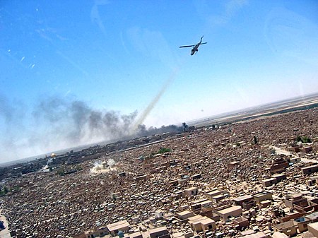 AH-1W Super Cobra attacks an enemy mortar position at Wadi-us-Salaam cemetery.jpg