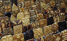 Several rows of large stamps of different symbols