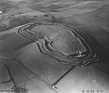 Hill forts spread across Europe in the Iron Age; Maiden Castle in England is one of the largest. Photograph taken in 1935 by Major George Allen (1891-1940). Aerial photograph of Maiden Castle, 1935.jpg