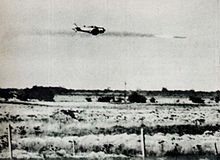 A rebel AT-6 combat trainer attacks a column of vehicles Argentine AT-6 is attacking column of vehicles in april 1963.jpg