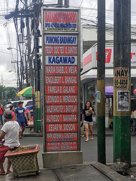 Information sign at the boundary of Barangay Socorro in Quezon City listing the barangay's officials