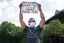 A protester holds a sign at the Minneapolis police federation on June 12, 2020 Bob KKKroll Must Go! Solidarity Rally for Justice in Minneapolis, Minnesota on June 12, 2020- 50002065137.jpg