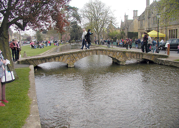 A pedestrian bridge across the River Windrush at Bourton-on-the-Water
