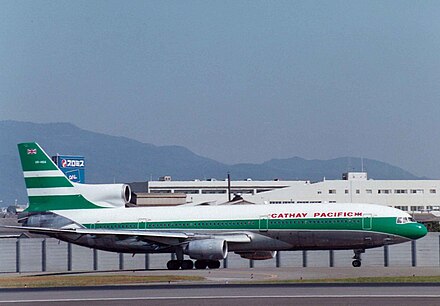 A Lockheed L-1011 TriStar at Osaka International Airport in 1972–1994 livery with the British Union Flag and the logo of parent company Swire.