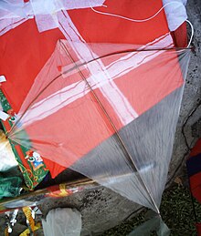 A chapi-chapi constructed from broom sticks and plastic sheet from a discarded plastic bag, on top of other kites. Chapi-chapi.JPG