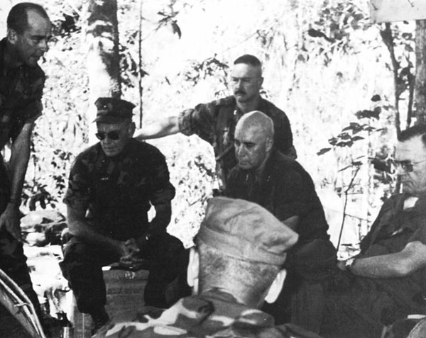 MG Youngdale (seated center without cap) during briefing on use of Scout Dogs during Operation Taylor Common with Commandant Leonard F. Chapman Jr. (e