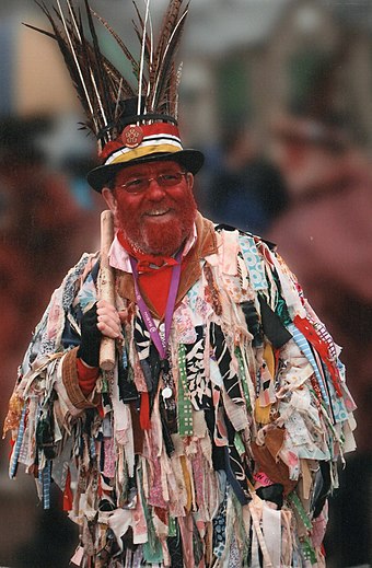 A Morris dancer with coloured disguise which was often used by dancers from the borders of Wales and England