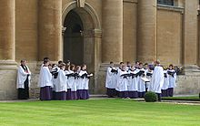 The choir performing in the Front Quad on Ascension morning 2009. Choir of The Queen's College, Oxford.jpg
