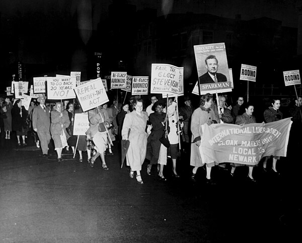 1952 political march by the International Ladies Garment Workers Union; among their signs is "Repeal Hartley–Taft Act"