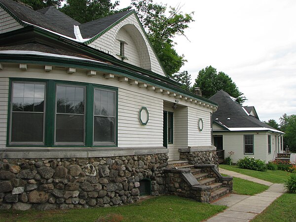 Two of the early Cure Cottages. Originally the first-floor porches were open; they were closed in by the American Management Association after the san