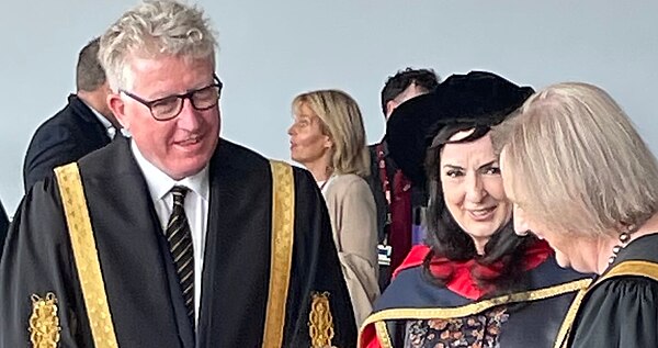 Moya Brennan after receipt of an honorary doctorate from DCU, with the university's president and chancellor, May 2022