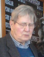 Galway Kinnell performing a poetic piece in Vermont Galway Kinnell Grindstone Cafe Lyndonville VT March 2013.jpg