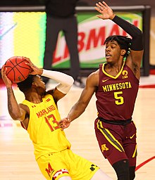 A Golden Gophers player (right) defending a Maryland player in 2021 Hakim Hart (50947354661).jpg