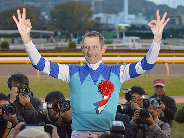 Bowman's trademark "She's Apples" celebration after winning the 2017 Japan Cup aboard Cheval Grand