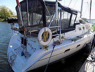 Hunter 44 stern view, showing transom details and enclosed cockpit with dodger and Bimini top combination Hunter 44 sailboat Dragonfly II 0561.jpg