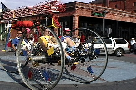 A participant team in the World Championship Kinetic Sculpture Race approaches the Old Town Eureka finish line, completing the first day of three in the internationally known event of people-powered art.